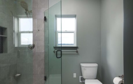 Aspen Custom Home Bathroom 2 Modern bathroom with glass shower enclosure and toilet