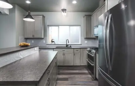 Aspen Custom Home Kitchen 2 - Inspire Homes Modern kitchen design with stainless steel appliances