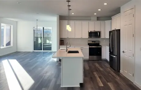 Custom Beach Kitchen - Inspire Homes Modern kitchen interior with sleek white cabinets
