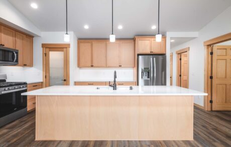 Custom Home Walden_Loop – Kitchen 1 Modern kitchen with wooden cabinetry and island