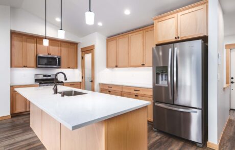 Custom Home Walden_Loop – Kitchen 2 Modern kitchen with wooden cabinets and island
