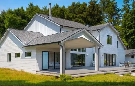 Cypress 3895 Back - Inspire Homes Modern two-story house with spacious wooden deck