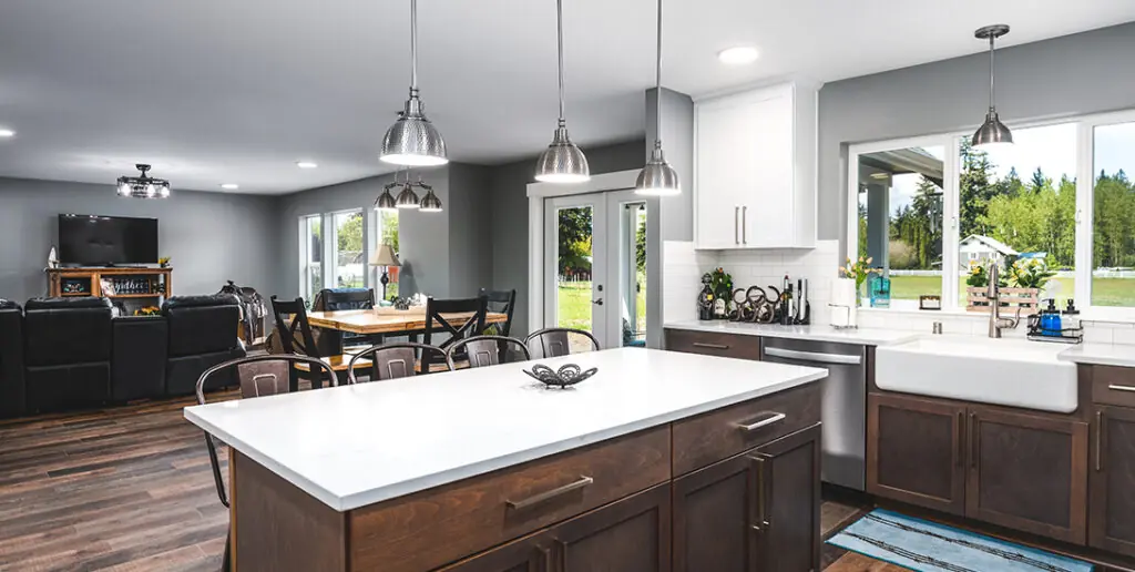 Efficient Home - Inspire Homes Modern kitchen and dining area with bright lighting