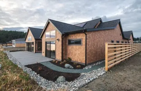 Gallery_0000s_0002_2213_skyline_way-9 - Inspire Homes Modern wooden house with stone pathway exterior