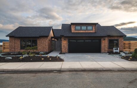 Gallery_0000s_0004_2213_skyline_way-3 Modern suburban home exterior with a spacious driveway.