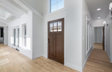 Gallery_0000s_0008_2217_skyline_way-42 Modern entryway with wooden door and hallway