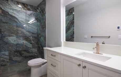 Gallery_0000s_0028_Inspire Homes – Anacortes – Fidalgo Villas – Custom Home – Quest Bath Modern bathroom with glass shower and sink.