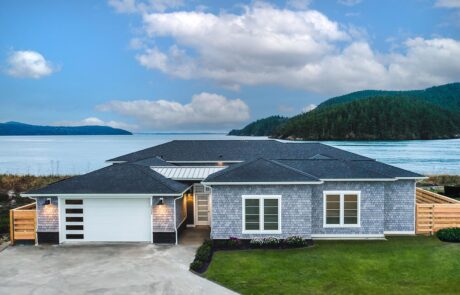 Gallery_0000s_0034_Inspire Homes – Anacortes – Fidalgo Villas – Custom Home – Exterior Coastal home with ocean view and hills.