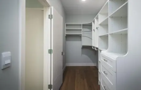 Gallery_0000s_0037_Inspire Homes – Anacortes – Fidalgo Villas – Custom Home – Closet - Inspire Homes Modern walk-in closet with white storage shelves