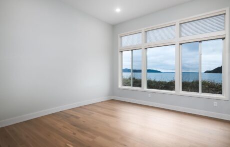 Gallery_0000s_0038_Inspire Homes – Anacortes – Fidalgo Villas – Custom Home – Bedroom Bright room with ocean view and windows