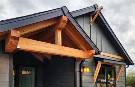 Inspire Homes Juniper Welch Entry Modern house exterior with wooden beam accents