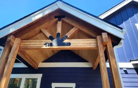 Inspire White Oak Timber Cover - Inspire Homes Wooden architectural details on house entrance porch
