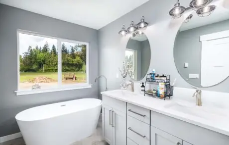 Madrona Custom Home Bathroom - Inspire Homes Modern bathroom with freestanding tub and vanity
