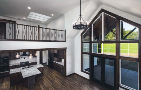 Redwood Custom Loft Modern open-concept living room with large windows