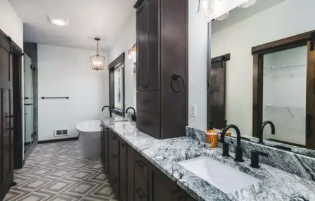 Redwood Custom Master Bath 1 - Inspire Homes Modern bathroom with granite countertop and fixtures