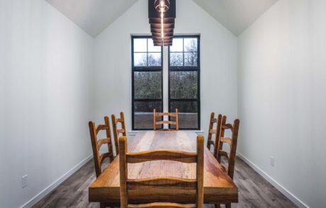 Redwood Timberframe Dining Modern dining room with wooden table and chairs