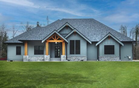 Redwood Timberframe Front Modern gray house with spacious green lawn