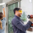 Couple renovating home with tools and paint - Shell Home Builder - What is a shell home?