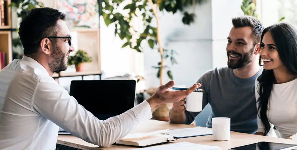 Understand the contract - Inspire Homes Advisor meeting with couple discussing financial plans