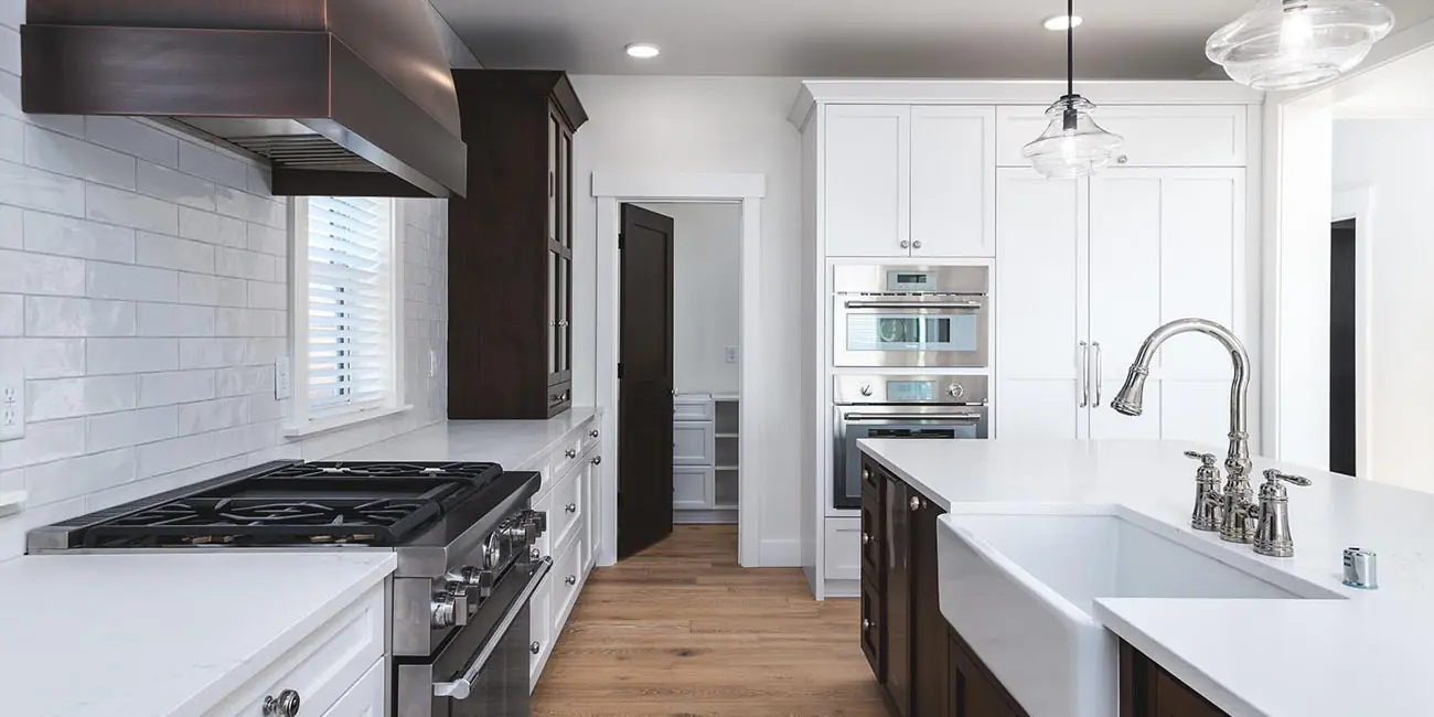 Modern kitchen with white cabinets and appliances