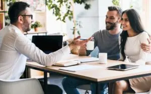 Couple meeting with a financial advisor professionally